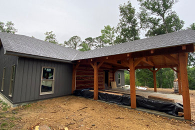 Large transitional gray one-story metal exterior home idea in Little Rock with a shingle roof and a gray roof