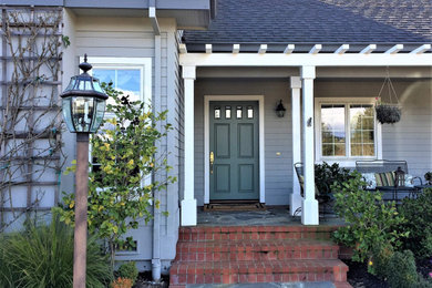 Inspiration for a large craftsman two-story concrete fiberboard house exterior remodel in San Francisco with a black roof