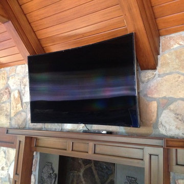 4k Curved LED TV Over Fireplace