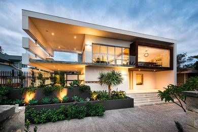 Mid-sized contemporary two-storey white exterior in Perth with metal siding.