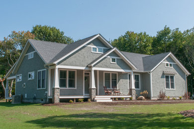 Large coastal blue one-story wood exterior home idea in Providence with a shingle roof