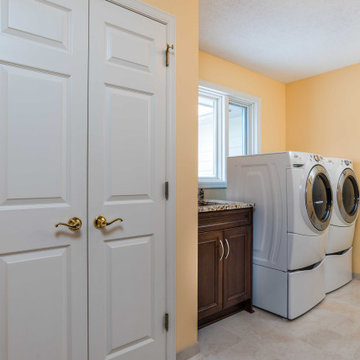Transitional Style Laundry/Mudroom With Medium Stained Maple Cabinets