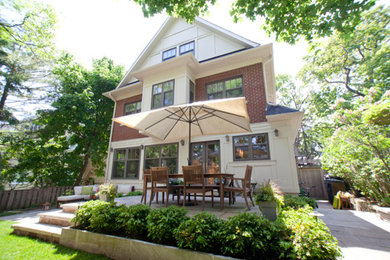 Example of a large classic multicolored two-story brick exterior home design in Toronto with a shingle roof