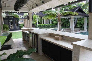 Large side yard tile patio kitchen photo in Hawaii