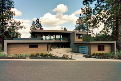 Huge contemporary two-story flat roof idea in Other