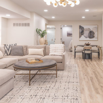 Warm & Inviting Basement Retreat with Custom Bar + Entertainment Center