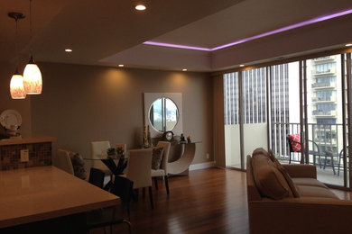 Mid-sized minimalist formal and enclosed bamboo floor living room photo in Los Angeles with beige walls