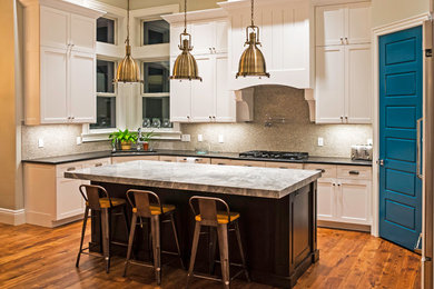 Open concept kitchen - mid-sized transitional l-shaped bamboo floor and brown floor open concept kitchen idea in Other with a double-bowl sink, shaker cabinets, white cabinets, marble countertops, multicolored backsplash, mosaic tile backsplash, stainless steel appliances and an island