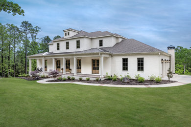 Example of a country exterior home design in Little Rock