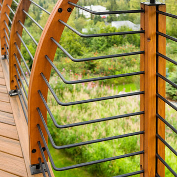 Contemporary deck with custom rails, decking, gate and greenhouse