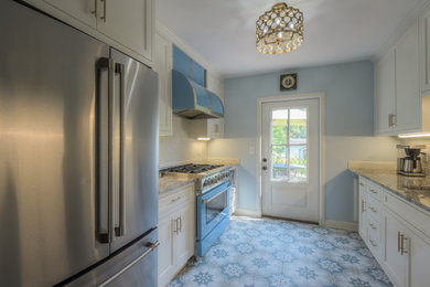 Inspiration for a french country galley ceramic tile and blue floor enclosed kitchen remodel in Kansas City with an undermount sink, recessed-panel cabinets, white cabinets, granite countertops, beige backsplash, ceramic backsplash, colored appliances, no island and multicolored countertops