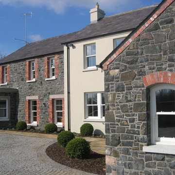 Newly Built Rendered Cottage with Stone Constructed Wings and Outbuildings