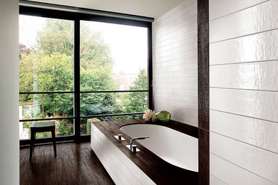 Inspiration for a bathroom in Vancouver with white tile and porcelain tile.