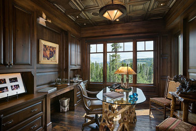 Inspiration for a large rustic freestanding desk dark wood floor and brown floor study room remodel in Other with brown walls