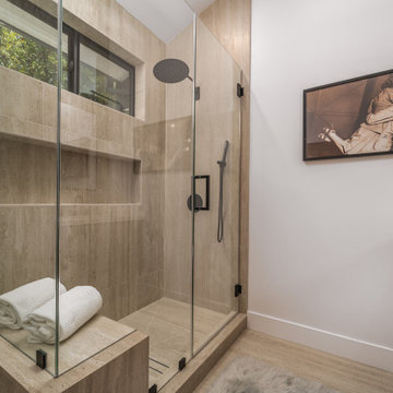 Primary Shower in Travertine with a Built-In Stone Bench