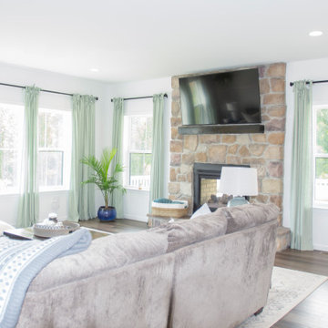 Living room's open floor plan accentuates large number of windows