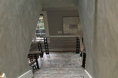 Staircase - mid-sized contemporary wooden l-shaped cable railing staircase idea in New York with wooden risers