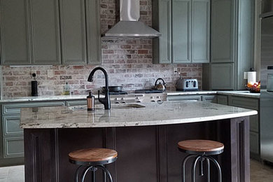 Mid-sized urban l-shaped ceramic tile and beige floor eat-in kitchen photo in Houston with an undermount sink, recessed-panel cabinets, green cabinets, granite countertops, red backsplash, brick backsplash, stainless steel appliances and an island