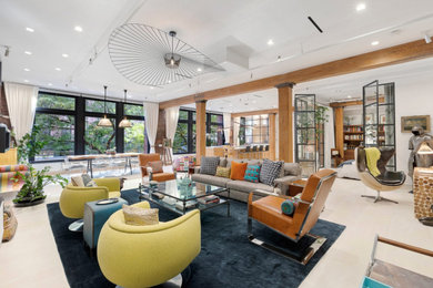 Example of an eclectic beige floor living room design in New York with white walls