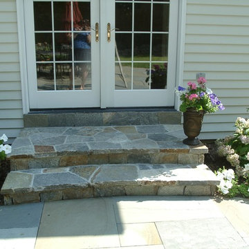 Curved stone steps lead to the terrace