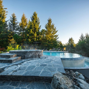 Vanishing Edge Concrete pool with spa and water feature