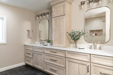Large transitional master ceramic tile, black floor and double-sink bathroom photo in St Louis with flat-panel cabinets, beige cabinets, quartz countertops and white countertops