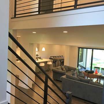 Amanda - horizontal steel railing with wooden newel posts