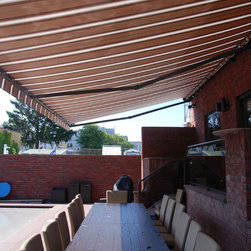 Another photo showing full table covered. - Awnings