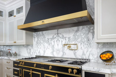 Kitchen - large transitional kitchen idea in New York with an island and marble countertops