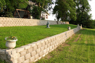 Inspiration for a mid-sized full sun backyard concrete paver retaining wall landscape in Omaha.