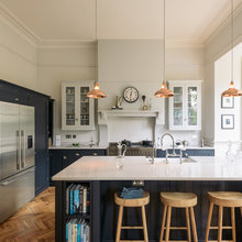 dark blue and light coloured cabinets kitchens