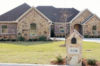 Large elegant beige one-story mixed siding house exterior photo in Austin
