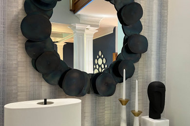Inspiration for a modern wallpaper entryway remodel with blue walls and a dark wood front door