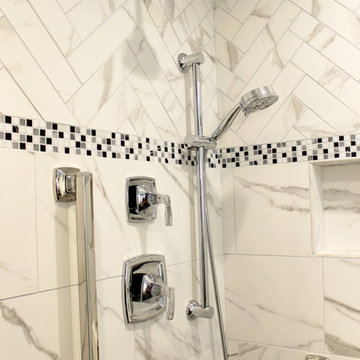 White and Gray MasterBath with Marble Look and Herringbone Tiled Shower