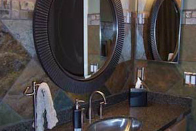 Inspiration for a contemporary bathroom remodel in Phoenix with dark wood cabinets, granite countertops and beige walls