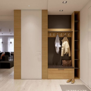 Small scandinavian foyer in Other with white walls, a single front door and a white front door.