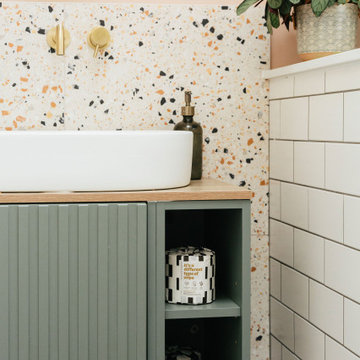 Pink & green bathroom with mix of tiles & patterns