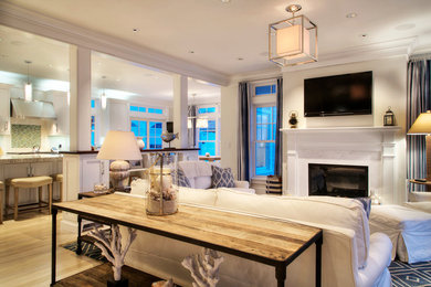 Mid-sized elegant open concept light wood floor and beige floor living room photo in Providence with a standard fireplace, a tile fireplace and a wall-mounted tv