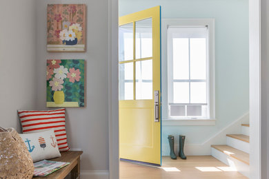 Mid-sized trendy light wood floor and beige floor entryway photo in San Francisco with blue walls and a yellow front door