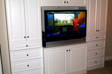 Example of a carpeted living room design in New York with beige walls