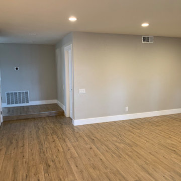 Open Concept Living Area with Warm Wood Flooring