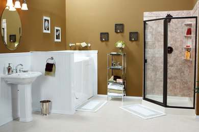 This is an example of a mid-sized traditional master bathroom in Dallas with an alcove tub, a corner shower, beige tile, ceramic tile, brown walls, laminate floors, a pedestal sink, beige floor and a hinged shower door.