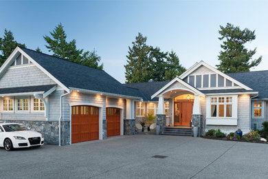 Example of a beach style home design design in Vancouver