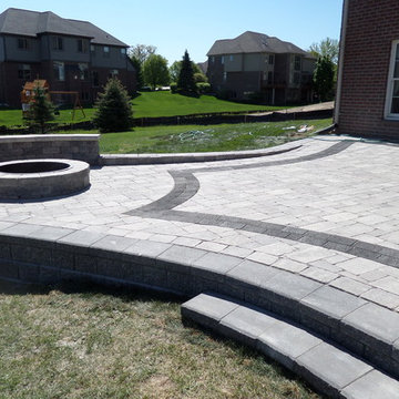 Raised Patio made with Unilock's Pisa Wall, Brussels and lL Campo Pavers