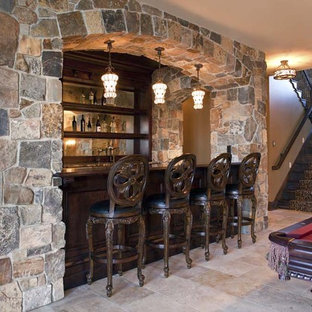 This is an example of a classic basement in Minneapolis with beige walls, travertine flooring and beige floors.