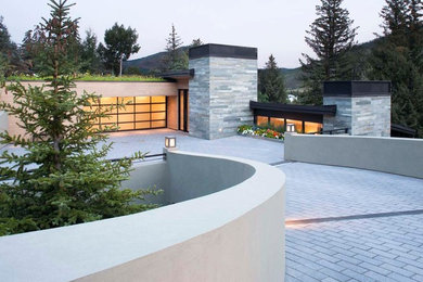 Inspiration for a contemporary gray split-level mixed siding exterior home remodel in Denver
