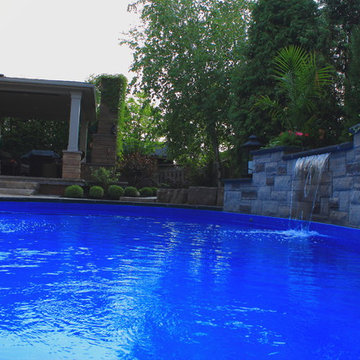 Natural Stone Water Feature with Spill Over Spa and Flagstone patio