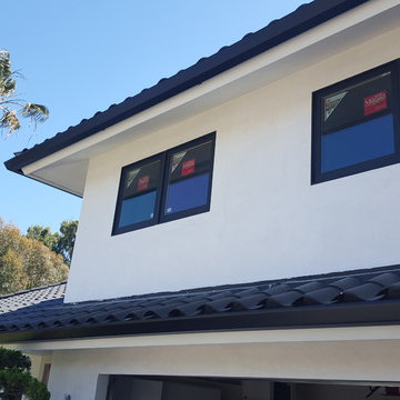 Huntington Beach California, White Fascia Wrap, Black 6 inch Angle Face Gutters
