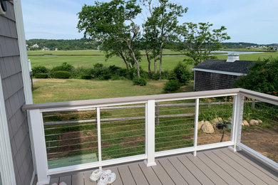Photo of a mid-sized beach style deck in Boston.