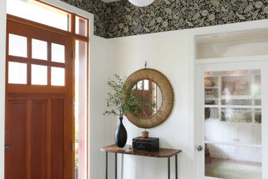 Example of a cottage entryway design in Other